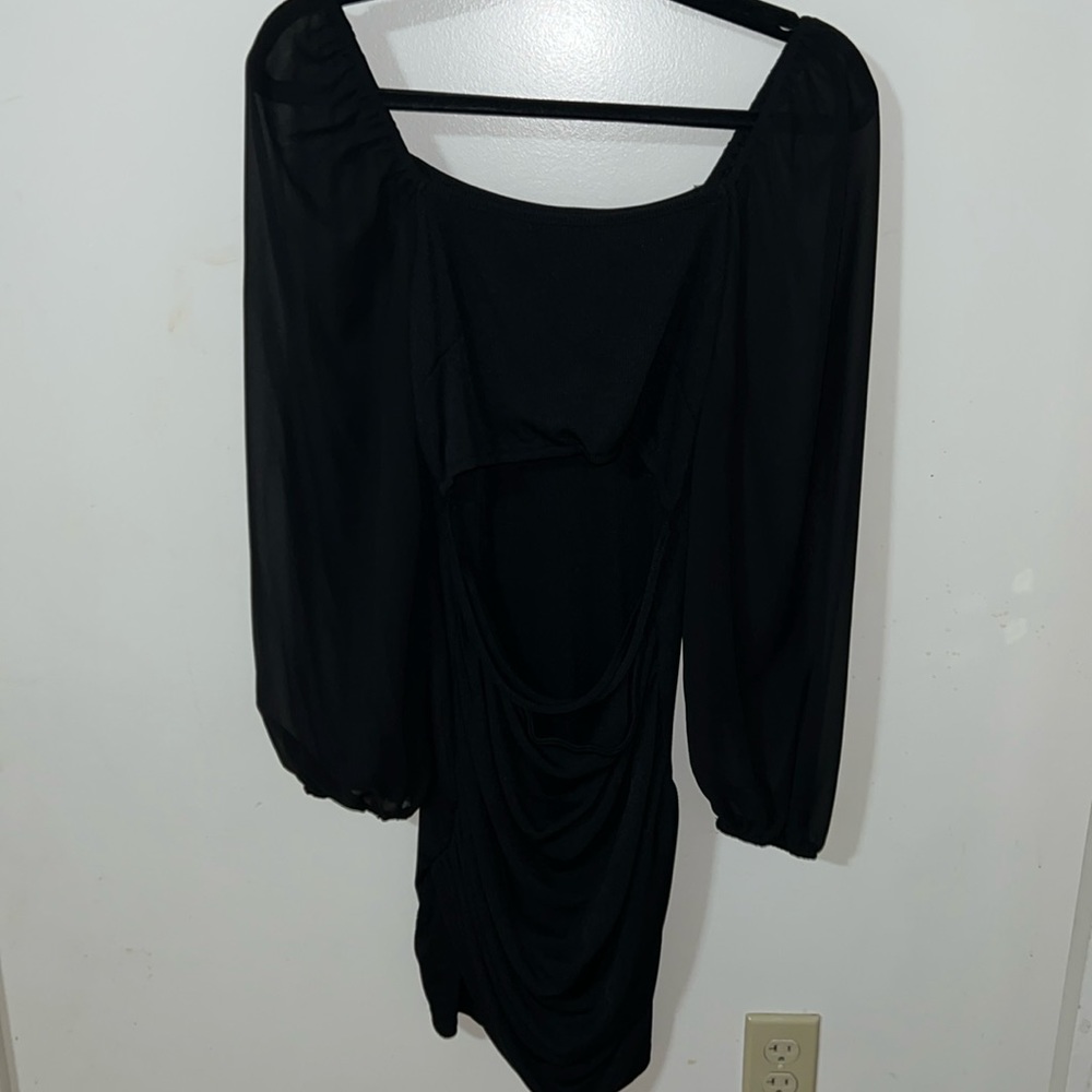 Mini skirt dress with sheer sleeves and mid section open